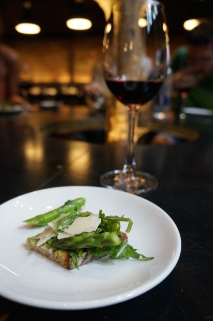 Third taste: Avocado, asparagus, parmesan cheese on fresh baguette flown in from Paris, avec vino.